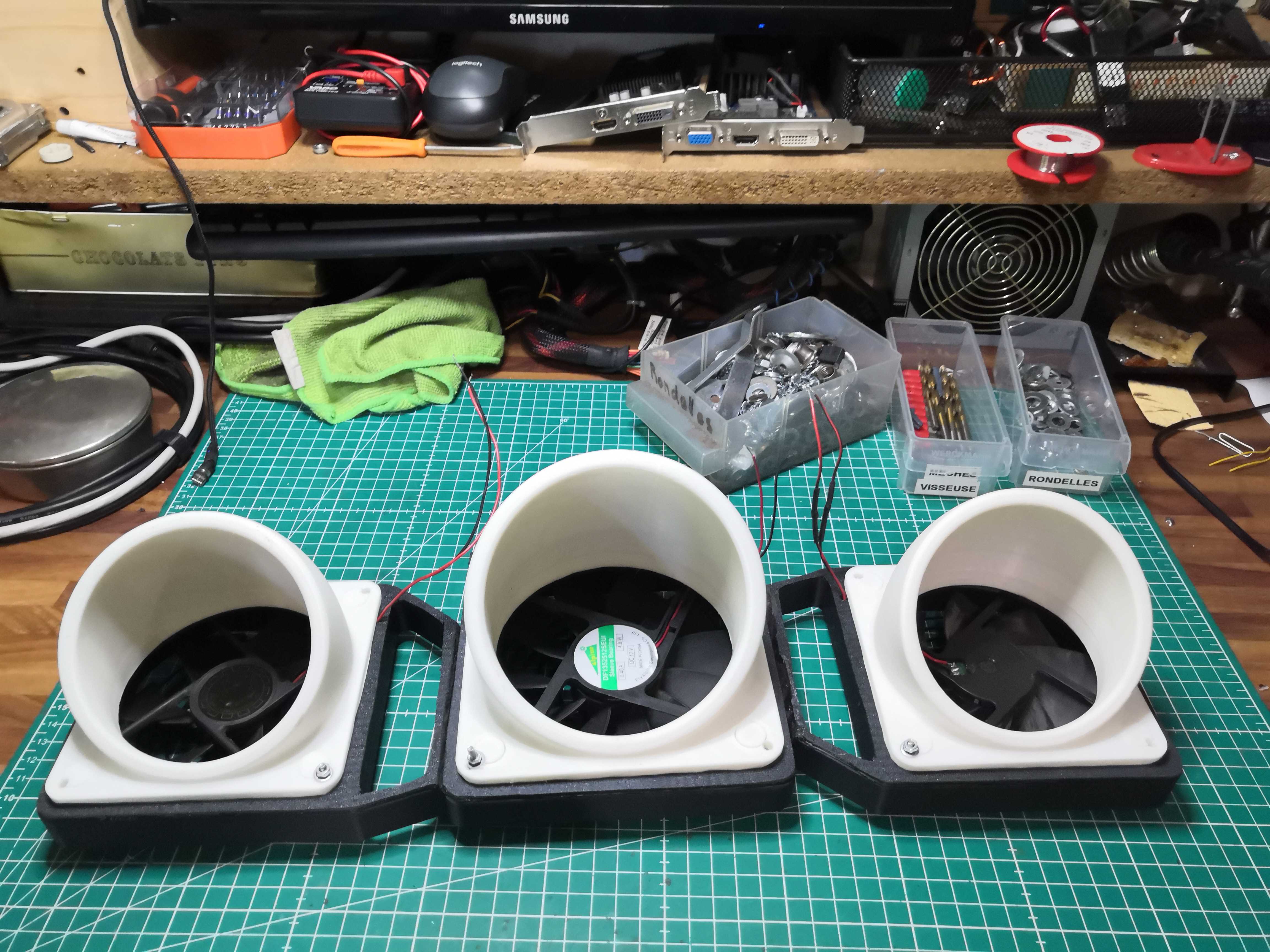 Close-up of the nozzle outlets; 12 V fans visible inside