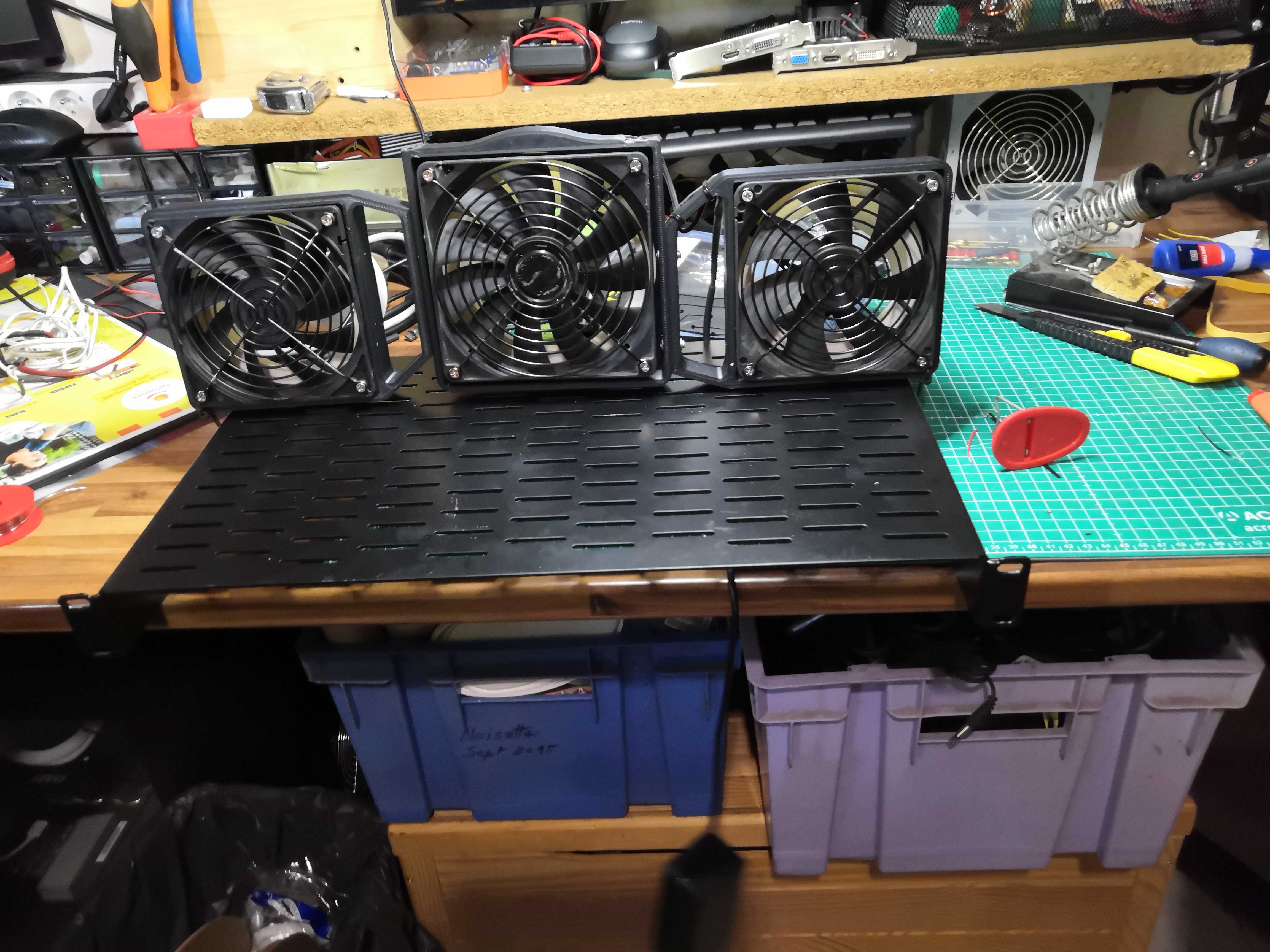 Test mounting the three fans on a rack shelf
