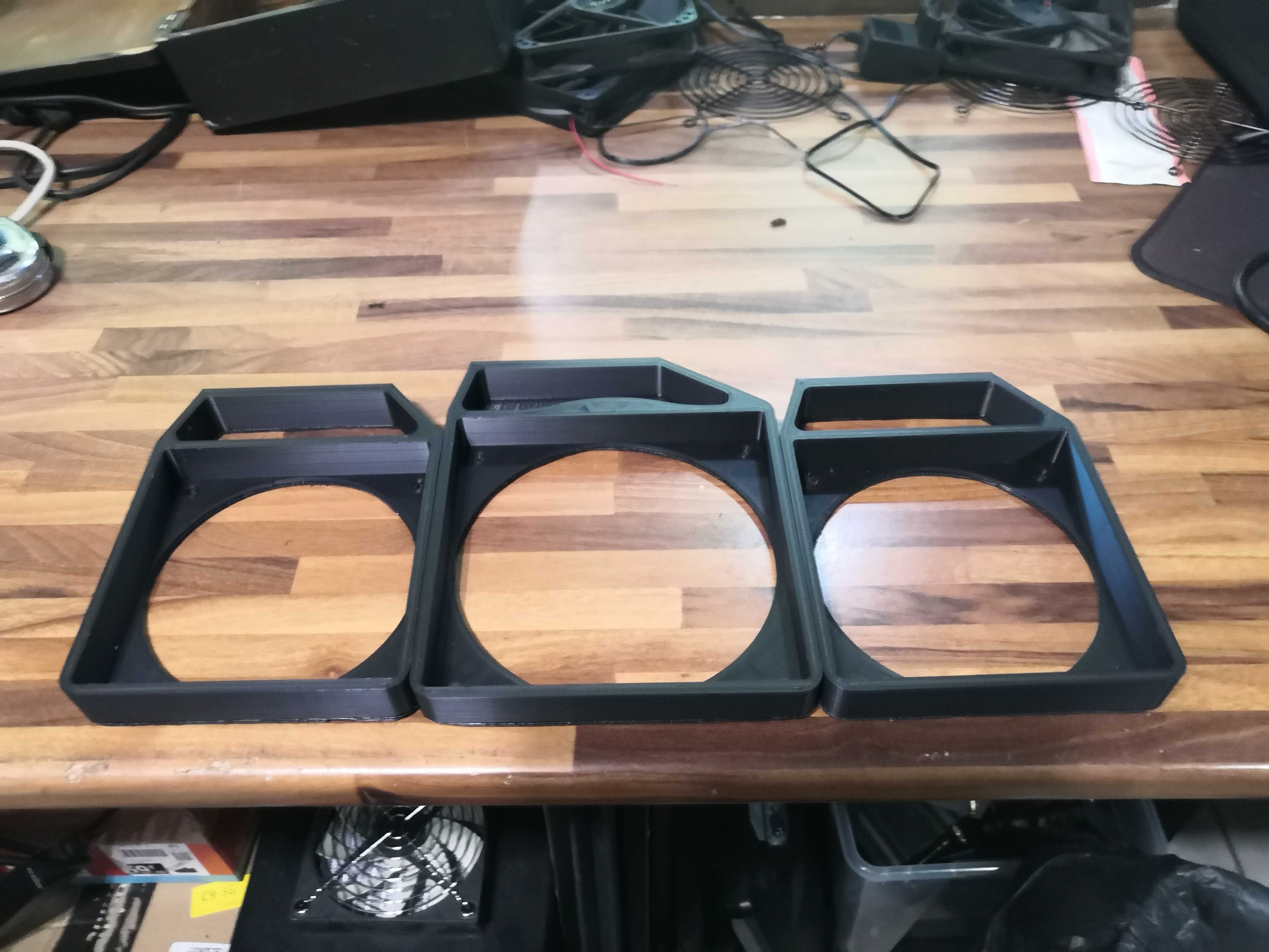The three brackets: two 120 mm ones and the wider 140 mm one in the center