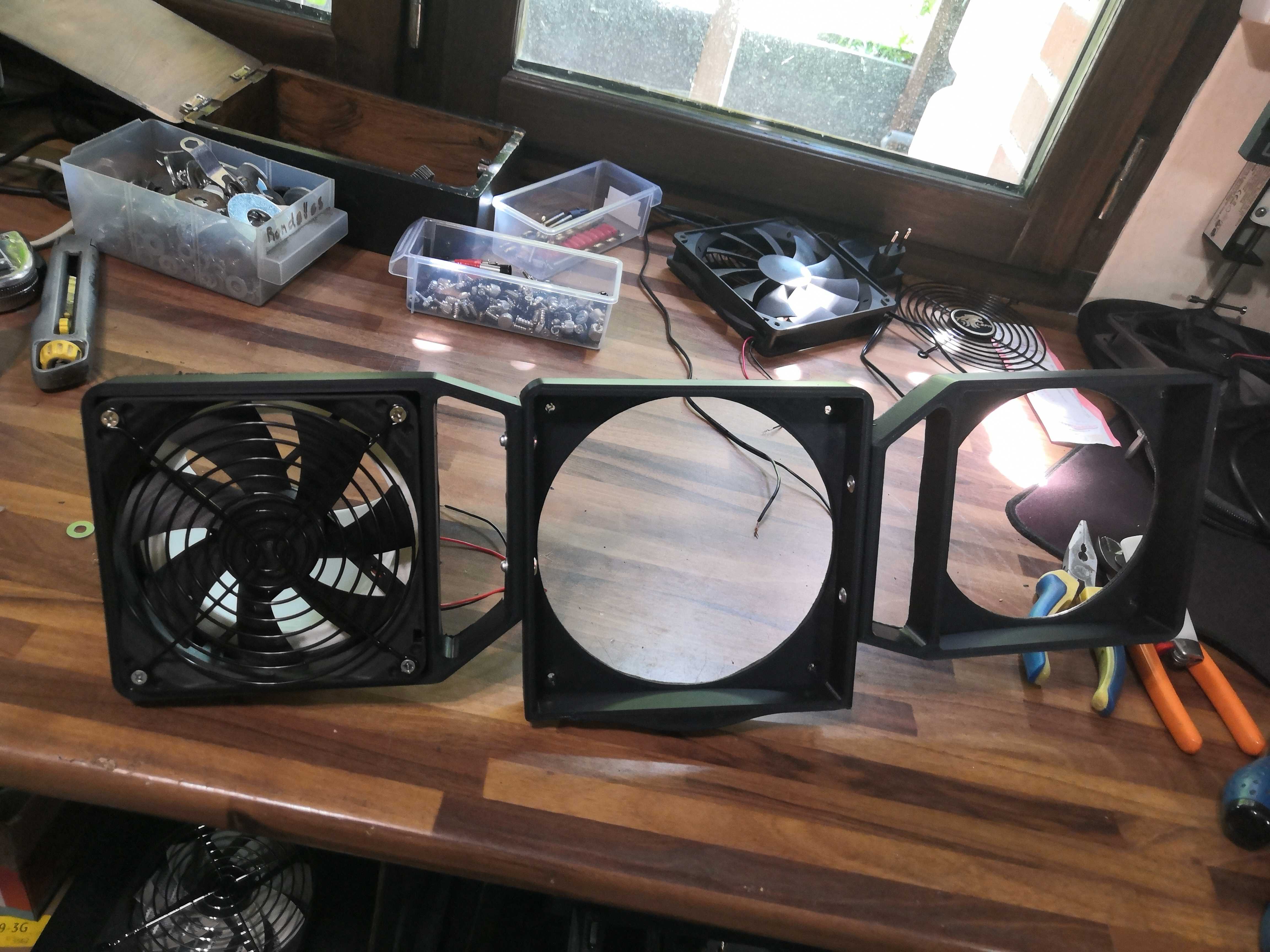 The first fan (with its grille) mounted in its bracket