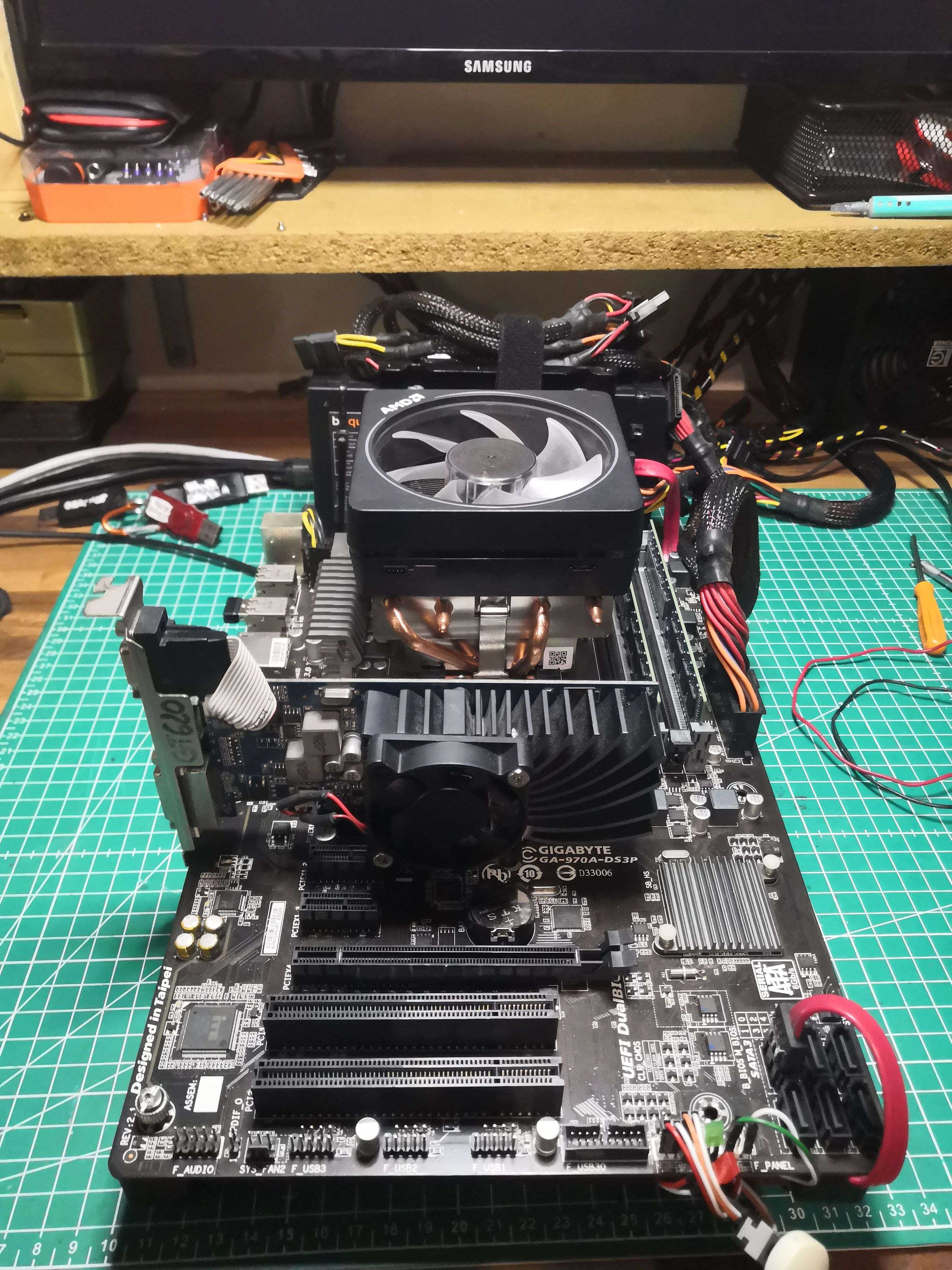 The THANOS test bench — Gigabyte 970A-DS3P on the cutting mat