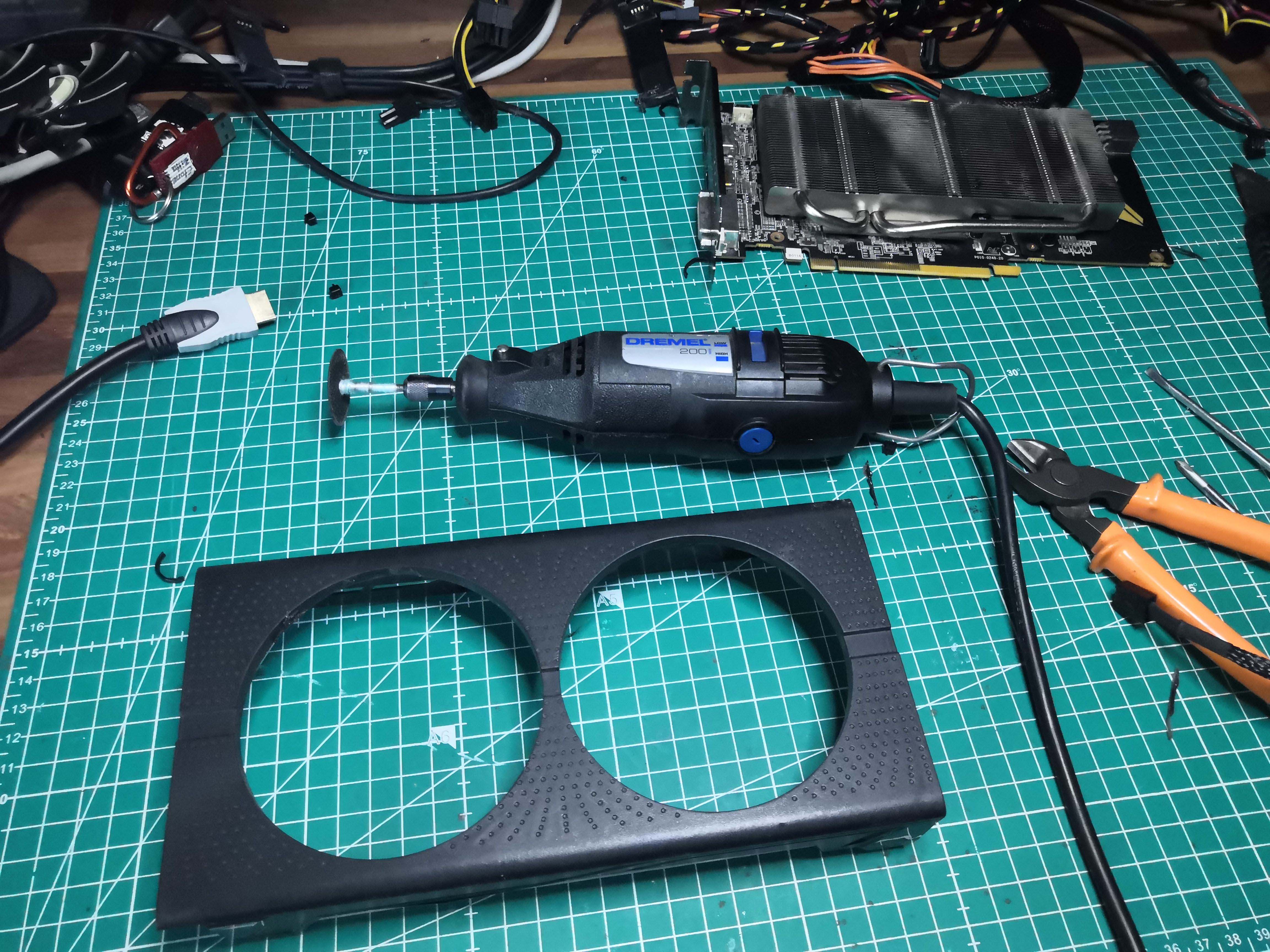 Dremel placed next to the modified shroud
